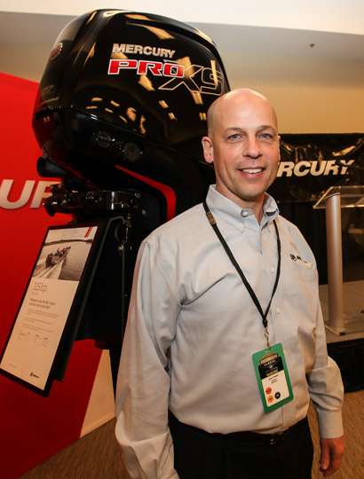 Mercury's President John Pfeifer is pictured with the new 115 Pro XS FourStroke outboard.  