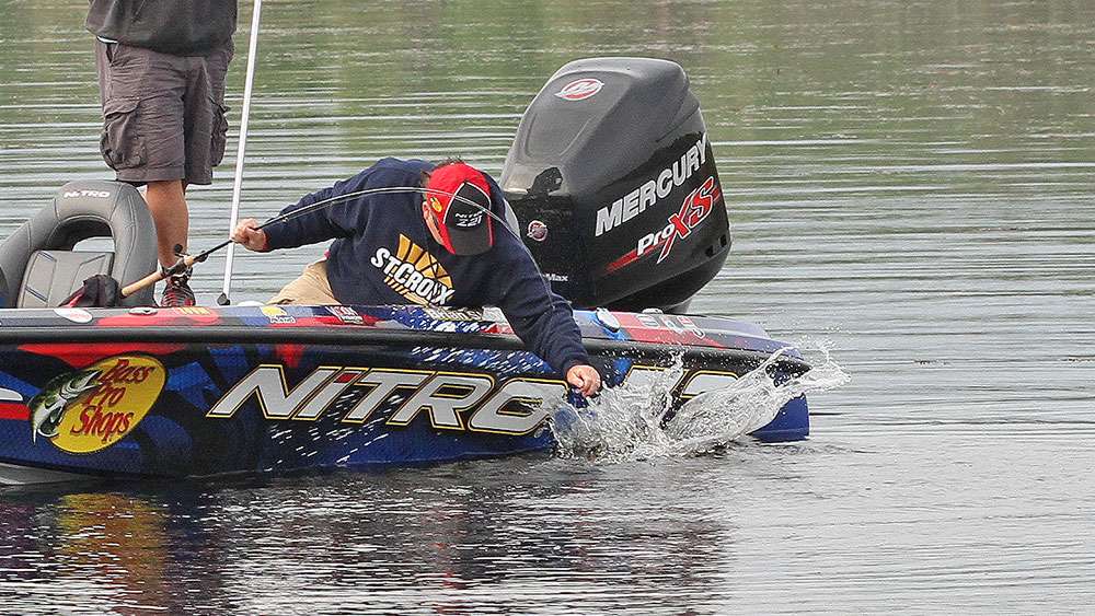 After some excessive splashing, Snowden gets the bass corralled and put into his livewell. 