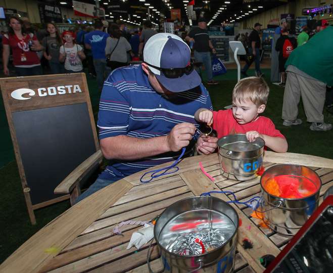  Father and son are spending some quality time in the Costa booth today.