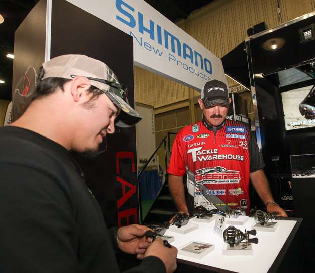 Jared Lintner detailing the new Shimano reels for a fellow angler