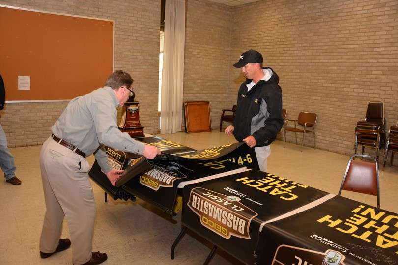 Bill Keefer helps aligns the 2016 Bassmaster Classic banners that were displayed throughout Grove and Tulsa.