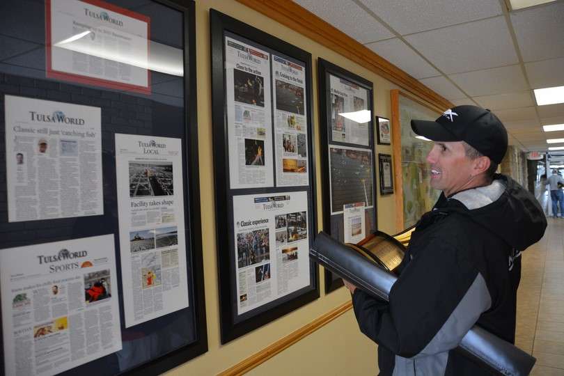 Edwin takes a quick stroll by the Tulsa World archive displayed on the wall from the 2013 Bassmaster Classic.