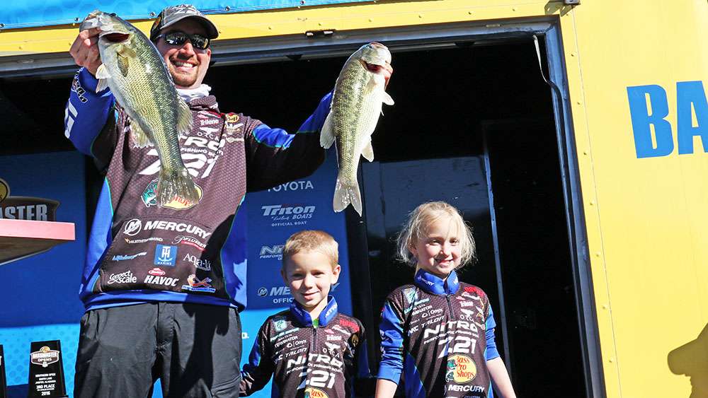 Elite Series pro Ott DeFoe holds up a couple of nice fish with his young children by his side. It's great to see so many of these anglers deeply involve their kids in the sport. 