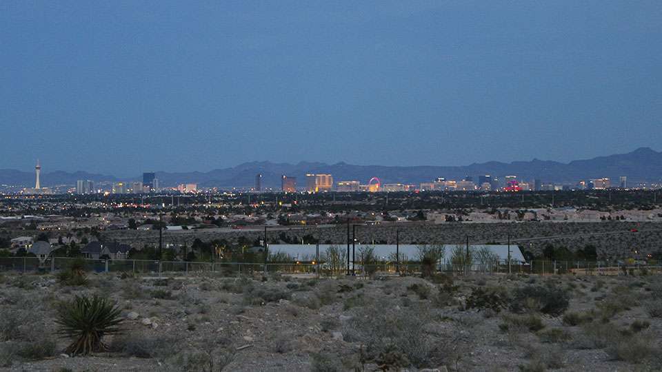 In the distance Vegas glows as the sun starts to set.
