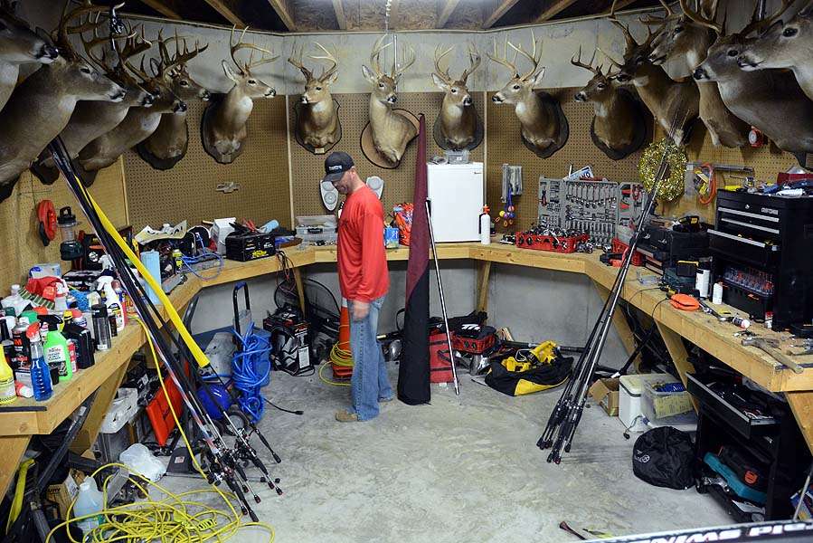The boat is conveniently parked beside what is called the Antler Room.  The mix of deer mounts, tools, tackle and various manly goods is uniquely man cave. Everything needed to equip the boat is here, along with wall art meeting approval of any modern cave man. 