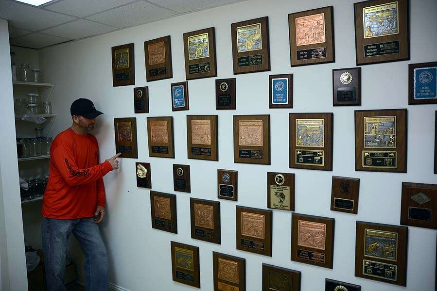 What looks like a wall of fame lined with trophy plaques is actually inside what Swindle calls the Throne Room. Itâs where he contemplates his successes while taking care of other business. 