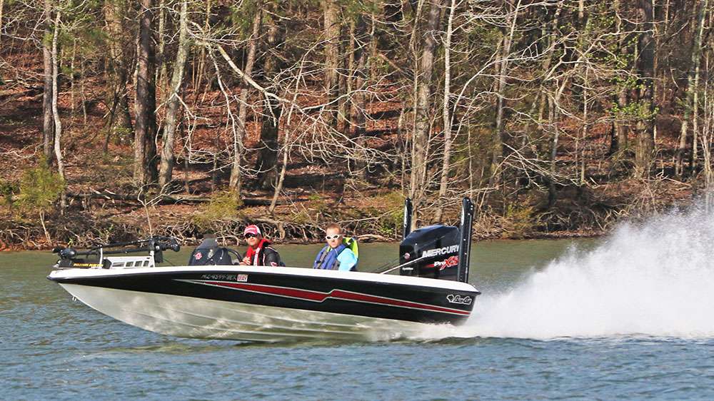 Pro angler Aaron Owens and his co-angler Roman Holmes race to the next spot while Pons and Oswalt continue their assault. 