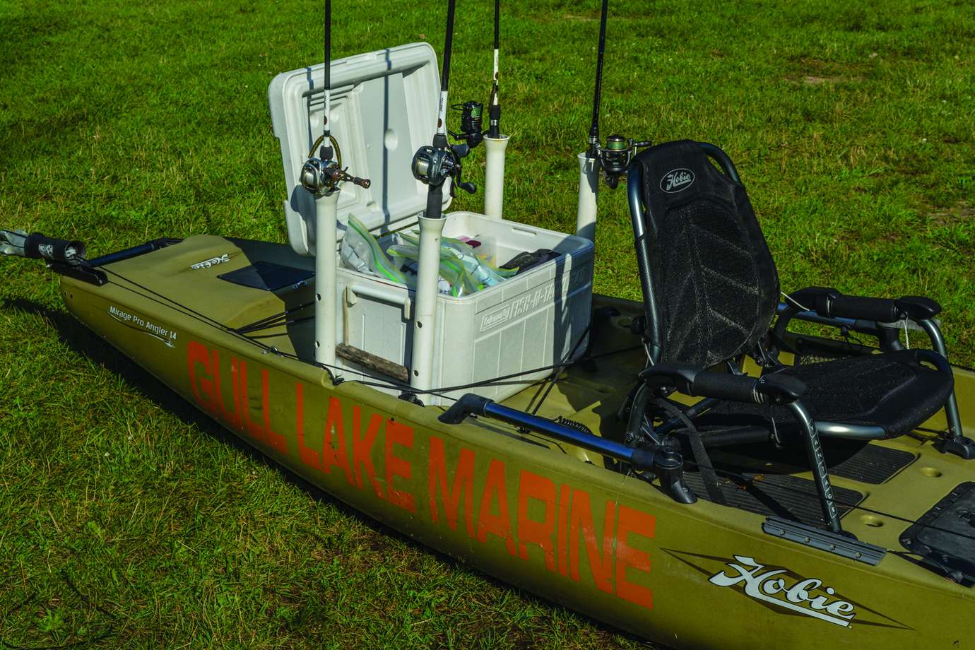 A cooler can turn into a tackle crate that carries four rods outside and lots of tackle inside. Want a fish fry? Replace bass tackle with ice and load up on some crappie. PVC pipes have flared tops that make it easy to slide rod handles in behind your seat. A backing strip between the cooler and pipe keeps the flare clear of the cooler lid when you need to get at your tackle. The toughest part of this project is drilling neat holes in the PVC pipe.