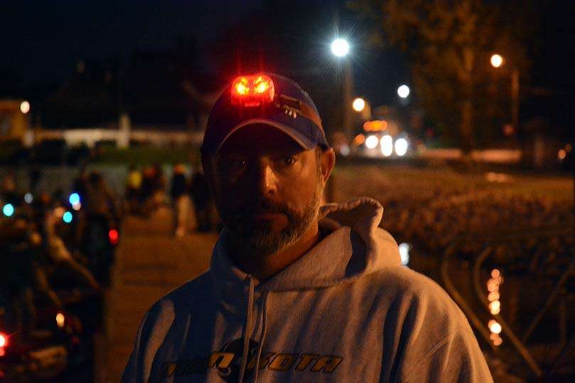 This angler tells his partner on the phone to look for the guy with the red light. No problem finding him. No one else is wearing a red light on their head. 