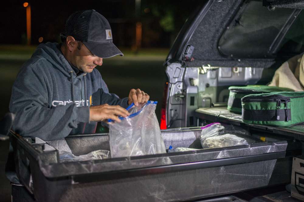 After a surprisingly strong Day 1 on Lake Wheeler, anglers roll down to the ramp on Day 2 with hopes of an equally big day. Matt Lee digs through a few bags of soft plastics while he waits to launch his boat. 