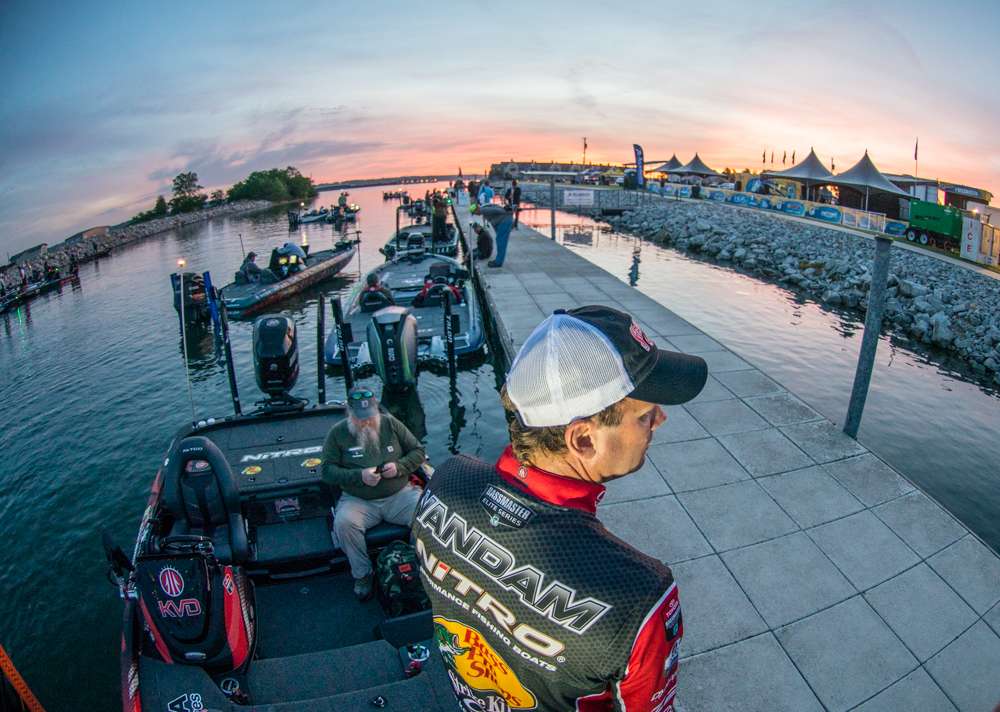 After a strong day one Kevin VanDam looks out at a rising sun and plans his Day 2 tactics. 