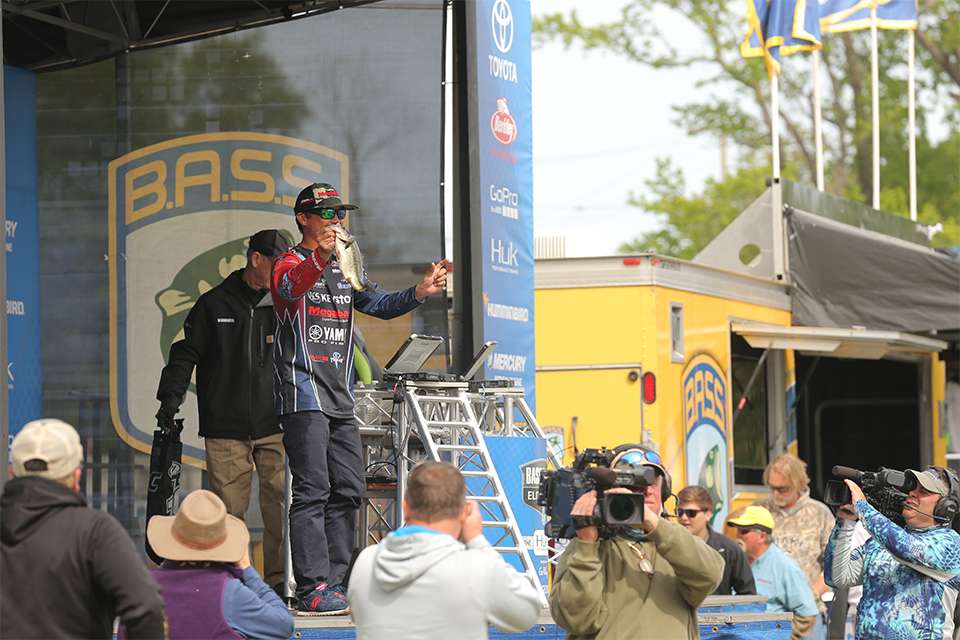 Chris Zaldain shows his catch on the stage.