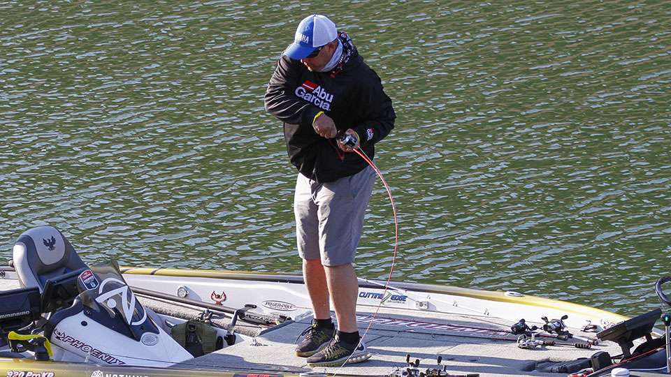 And the fight was on as Bobby Lane snatched this fish off a bed and hoped to get it in the boat to round out his limit.