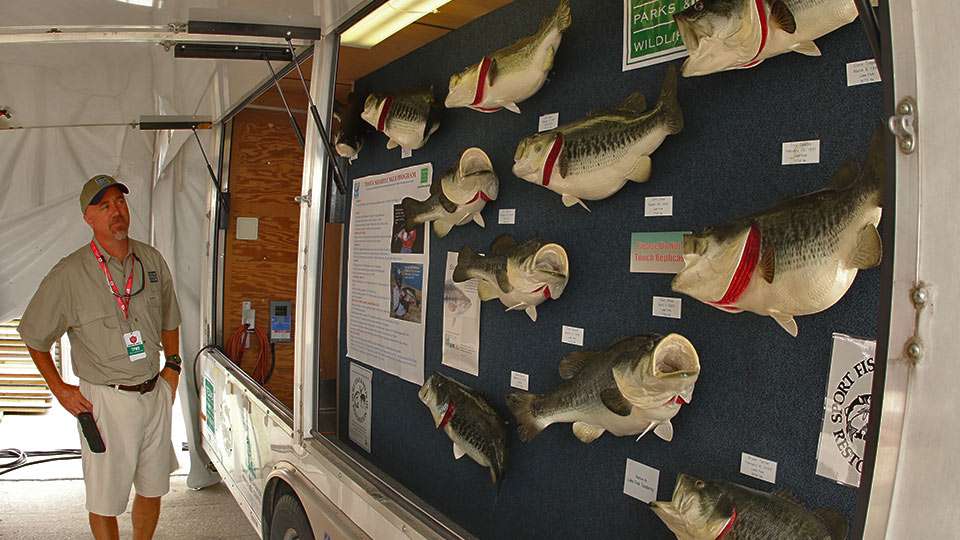 Michael Baird, a TPWD fisheries biologist, is with the trailer that shows off the top Toyota ShareLunker bass in the programâs history.