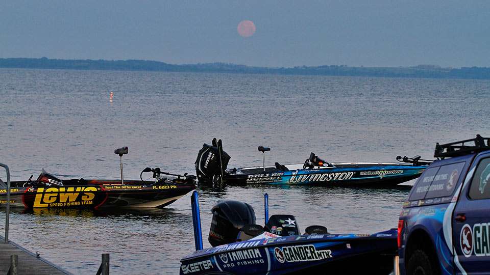 A full moon greeted anglers on Day 2 of the Toyota Texas Bass Classic at Lake Ray Roberts State Park. The boats of Peter Thliveros and Randy Howell float unattended waiting for their captains to hitch a ride to them.