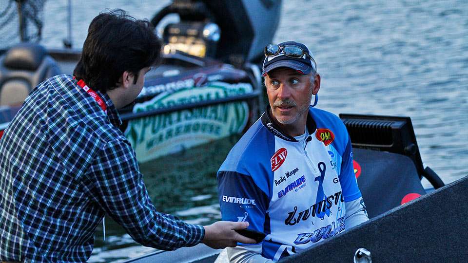 Andy Morgan talks with reporter Andy Canulette as the Tundra 10 prepare for the 7 a.m. launch for the final day of the Toyota Texas Bass Classic.