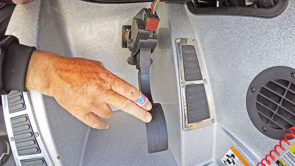 Beneath the steering wheel is an electronically driven gas pedal that is a very effective way to power the boat. 