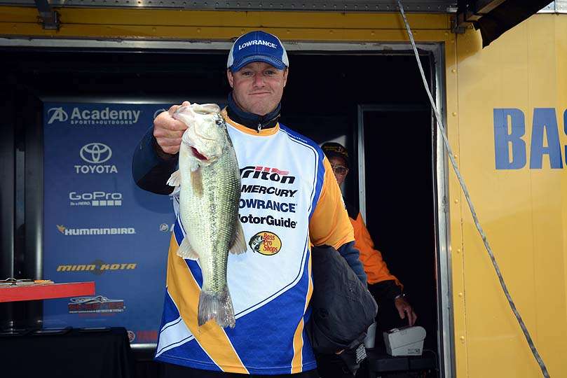 Craig Morris of Delaware poses with a great catch without wearing his rain gear. 