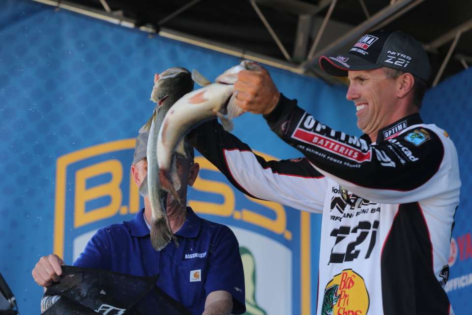 Edwin Evers shows his fish to the fans.