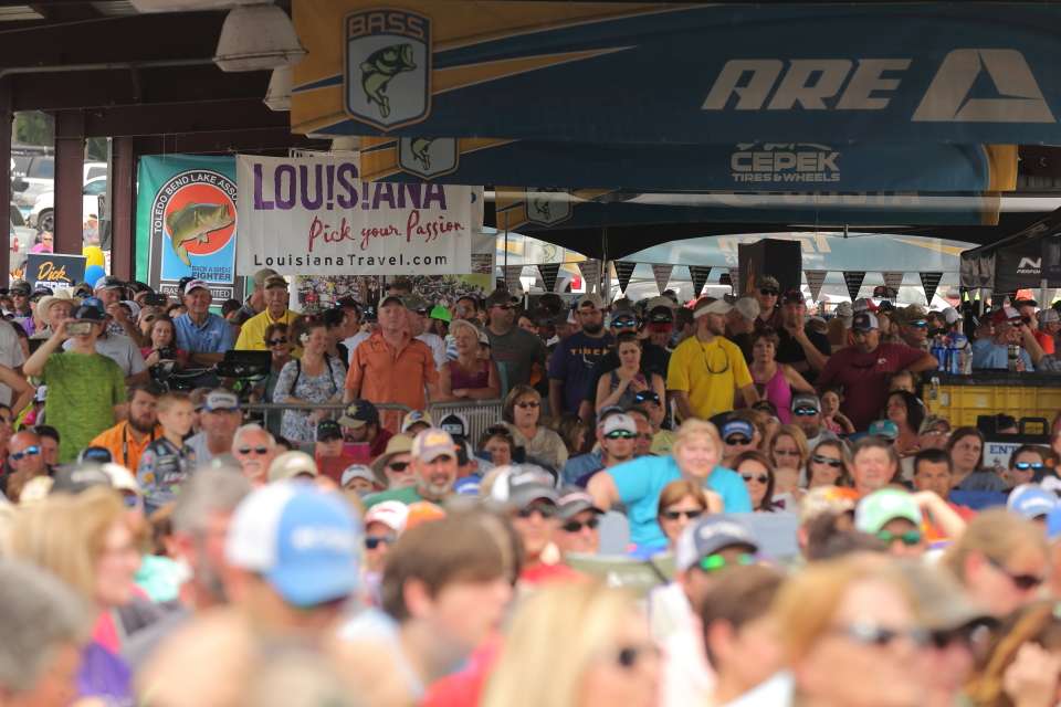 Fans pack the pavilion to get out of the hot Louisiana sun.