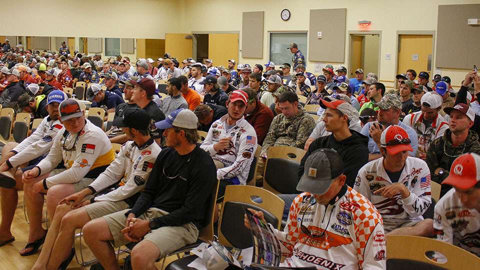The anglers gather in the meeting room and find a seat as the room fills up. 