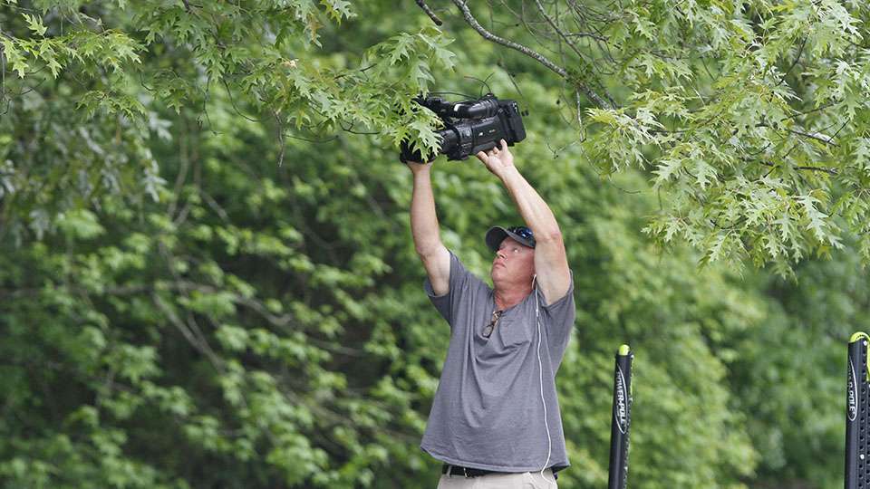 Cameraman Rick Mason gets a unique shot as Lefebre scoots under some overhanging trees.