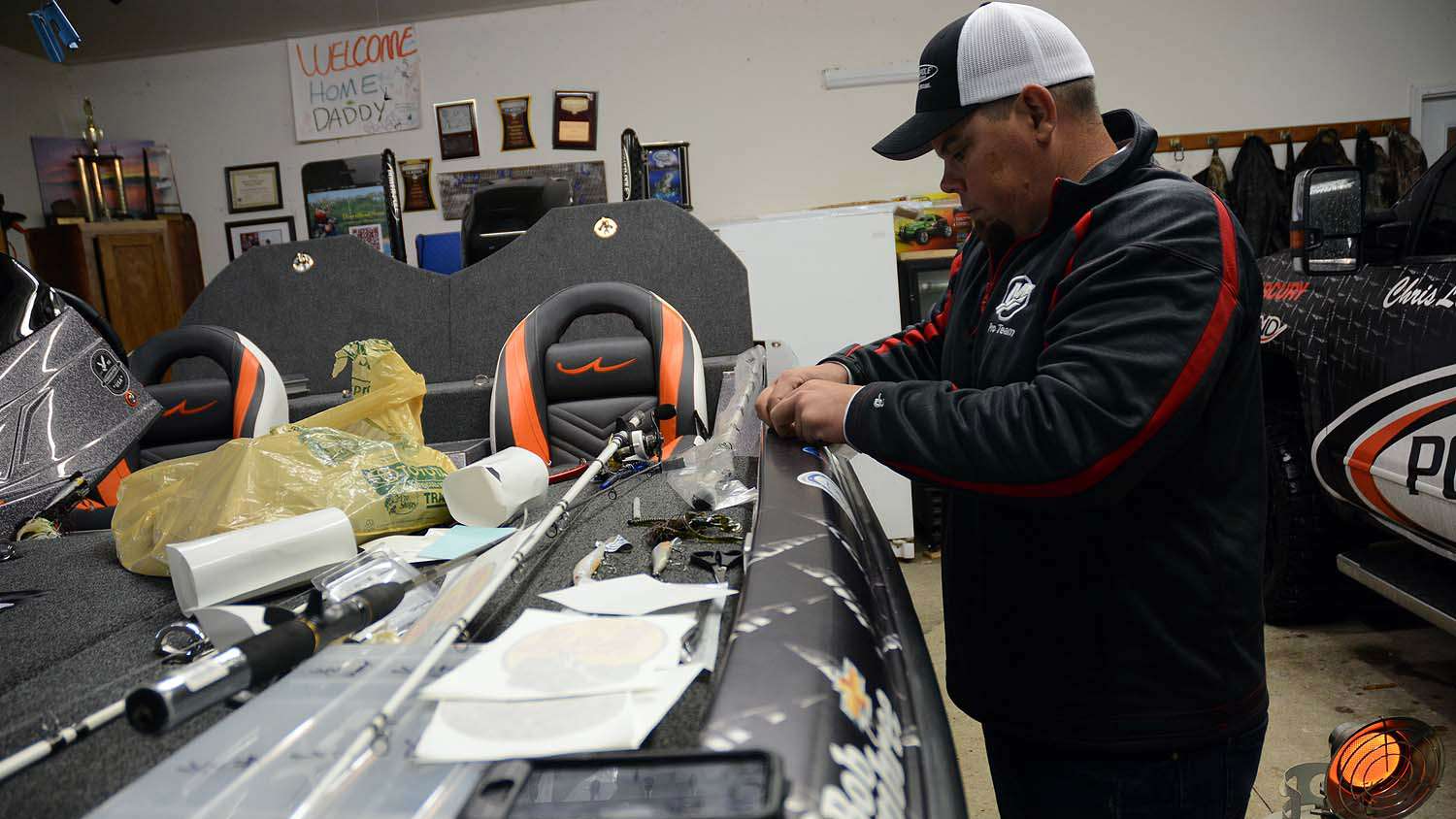 Lane gets busy putting the final touches on his new boat. There are minor details needing attention outside the final factory rigging job of his Legend rig. Tending to rods, reels and unpacking the familiar shopping bag from a Bass Pro Shops Outdoor World will have to wait. 