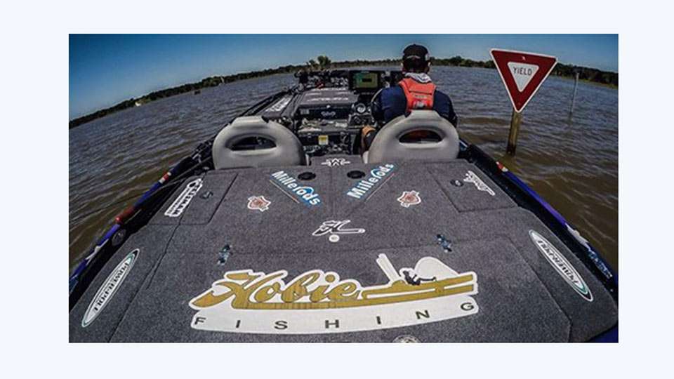 The Elites are visiting during high water, around 8 to 9 feet by most accounts. Here Elite pro Carl Jocumsen has a little fun by obeying the traffic signs in a flooded parking lot.