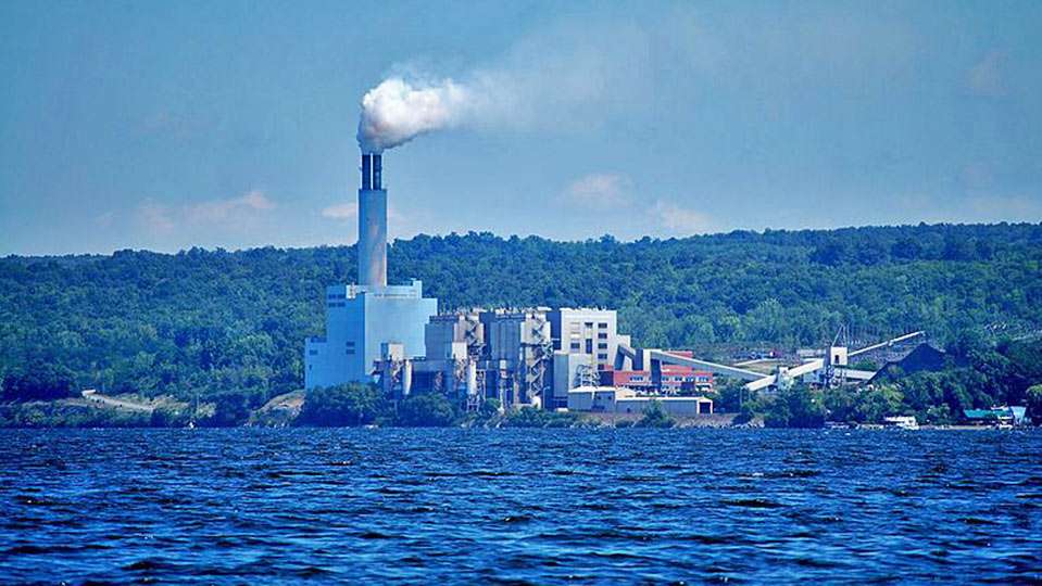 The AES Cayuga electrical generating station operates in the Town of Lansing, on the east shore of Cayuga Lake at mid-lake. The coal-fired plant uses lake water as a cooling source. The lakeâs average width is 1.7 miles and the widest point is about 3.5 miles near Aurora.
