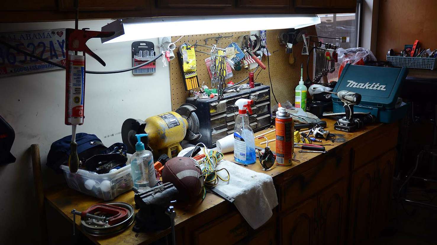 This looks like any workbench garage in America. Thereâs a football for tossing around in the front yard for breaks with his kids. Lane says this spot is for house chores and boat work. 