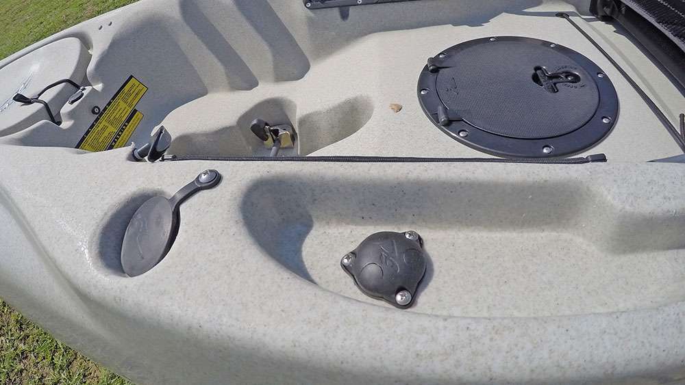 Near the front of the cockpit is another accessory port and rod holder. Those who choose to install electronics on their kayaks typically run the wiring through the port in the right-hand side of this image to mount the unit on the side of the boat. 
