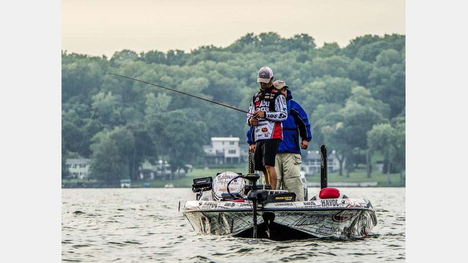Justin Lucas checks out his electronics, possibly monitoring one of the abundant humps. Cayuga also has long flats, loads of grass out to 20 feet or more and an ocean of deep, clear water. The 2014 Elite was in August, so some believe the grass wonât be as prominent this year.