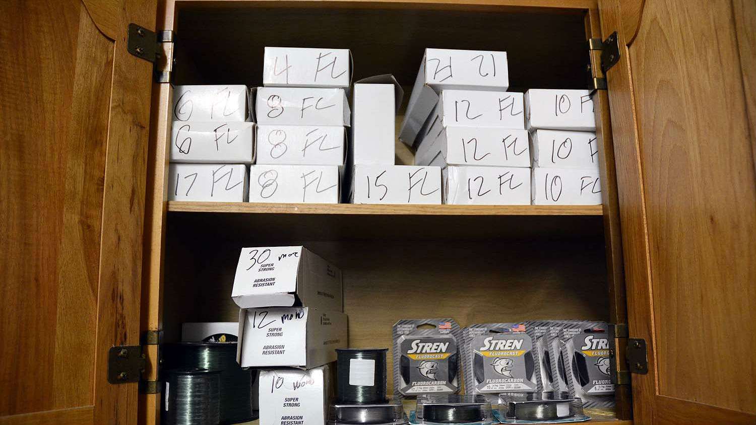 He proves the point on this shelf that is loaded with fishing line. The âFLâ label on the boxes stands for fluorocarbon. That is his line of choice, most of the time. 