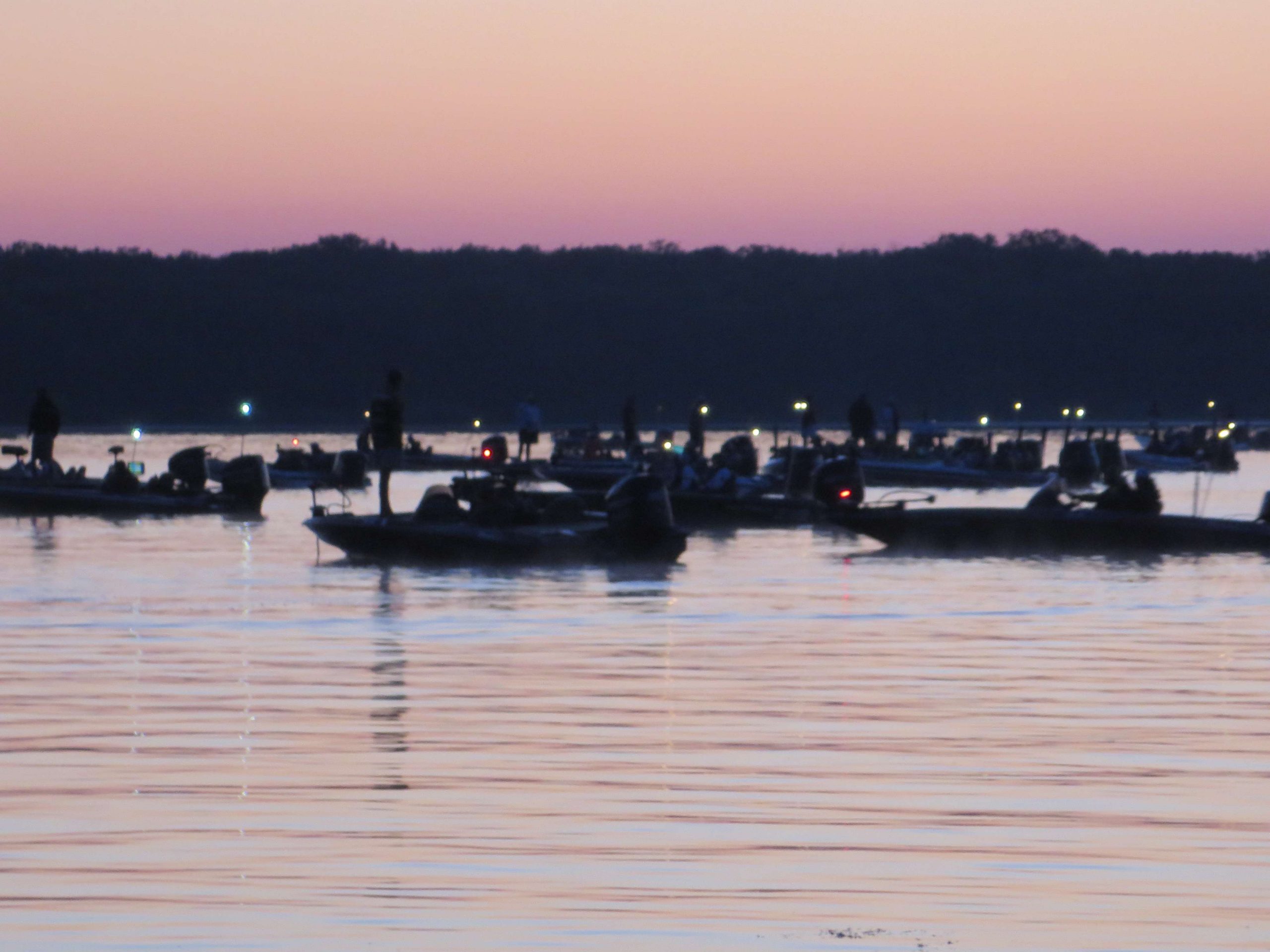 As 6 a.m. nears, the boats in the first flight move to the front of the pack. 