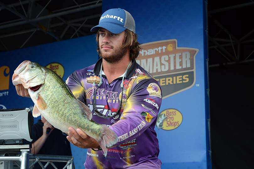Hunter Loudon of Bethel University with a largemouth weighing 8-7. The bass earned him the Carhartt Big Bass Award and a $500 gift card. 
