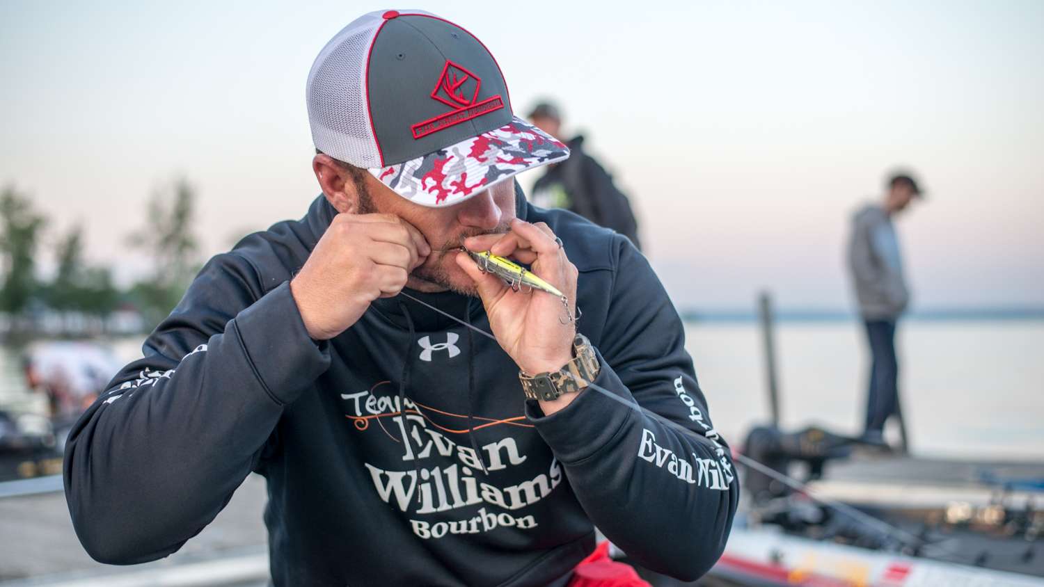 Hank Cherry finishes his knot on his jerk bait. 