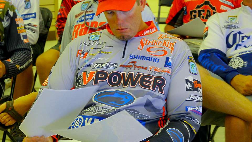 Keith Combs sat and read the handouts given to all the competing pros at the meeting. 