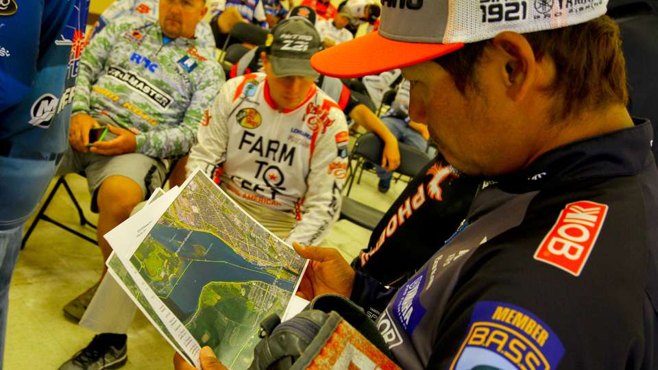 Ken Iyobe takes a look at the maps of the next event on the Niagara River. The top eight finishing anglers at this event will fish against one another for a berth in the 2016 Bassmaster Classic. 