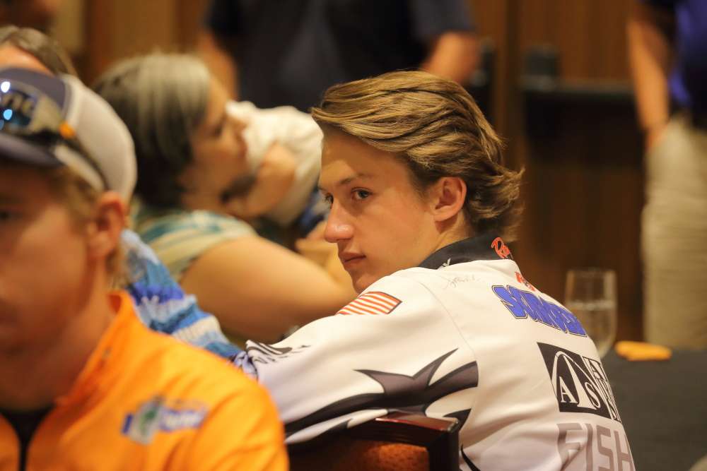 Bassmaster High School All-American Trey Schroeder listens intently as each B.A.S.S. speaker takes his turn at the podium.