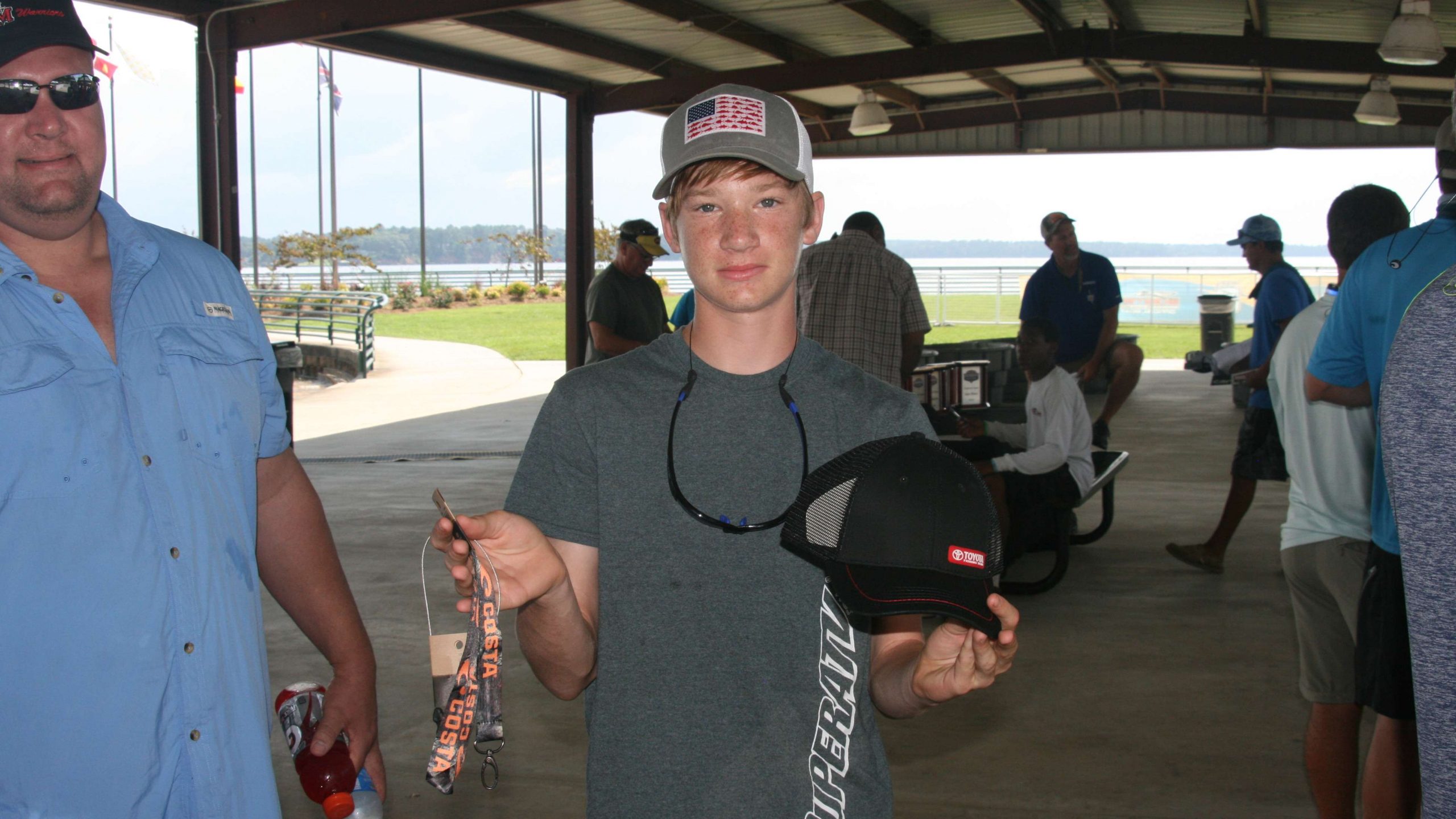 Jeremy Evans of St. Michael's High in Baton Rouge shows off some of the loot he received at the angler check-in.