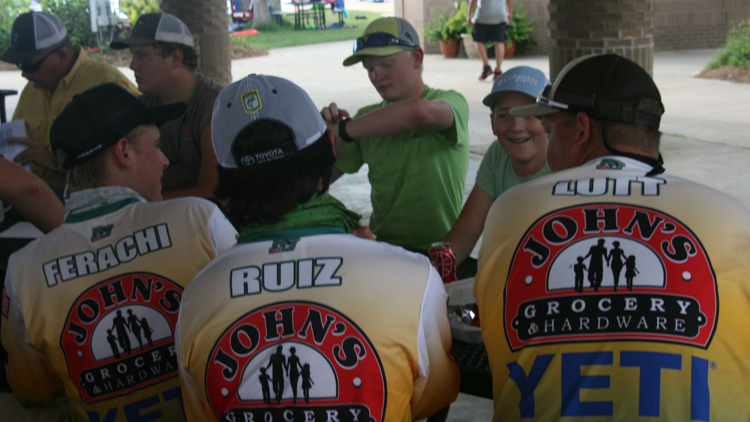These three young anglers finished their lunches and chatted with fellow anglers as they awaited the anglers' meeting.