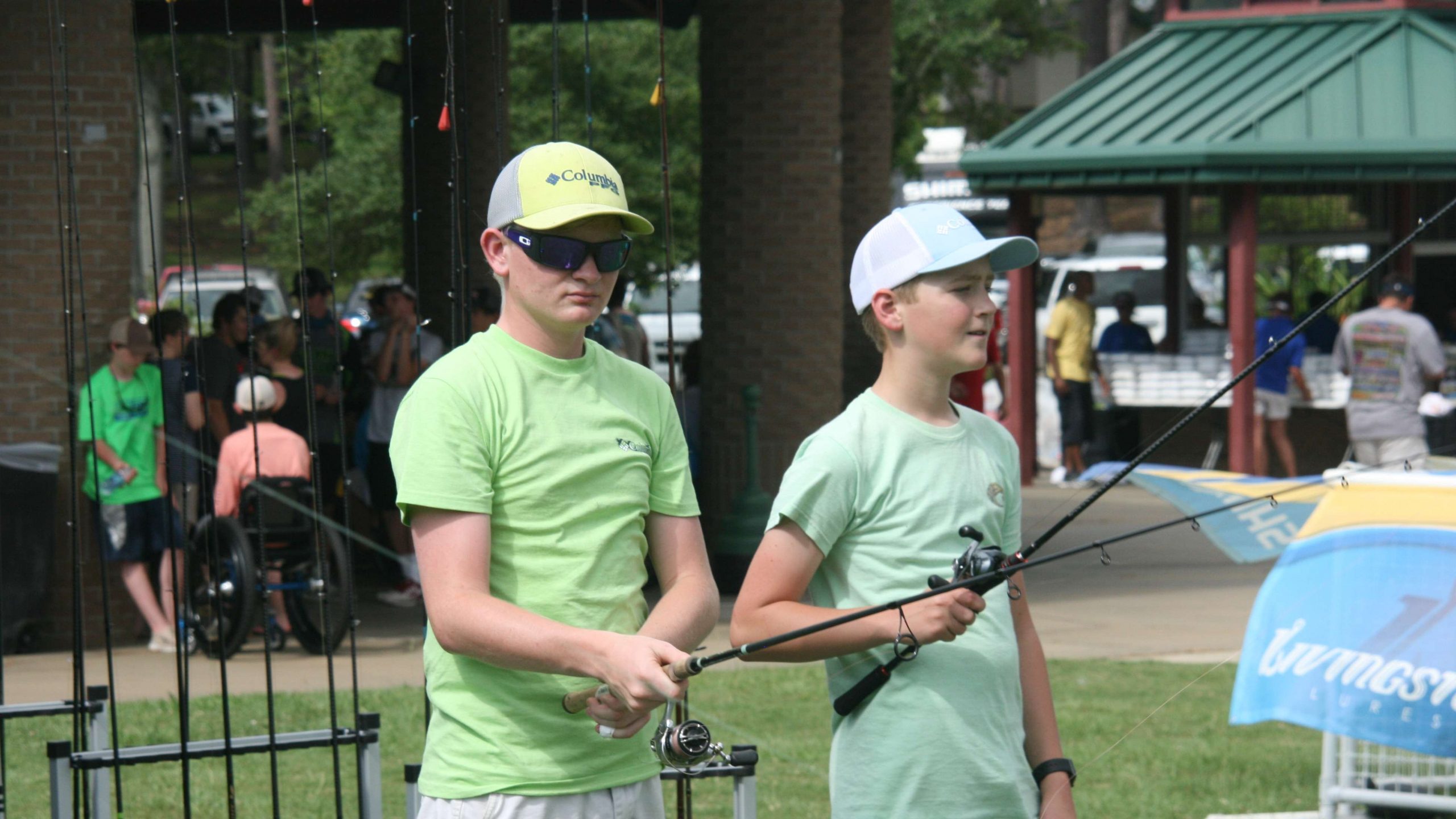 Some young anglers participate their casts at a Shimano station at registration.