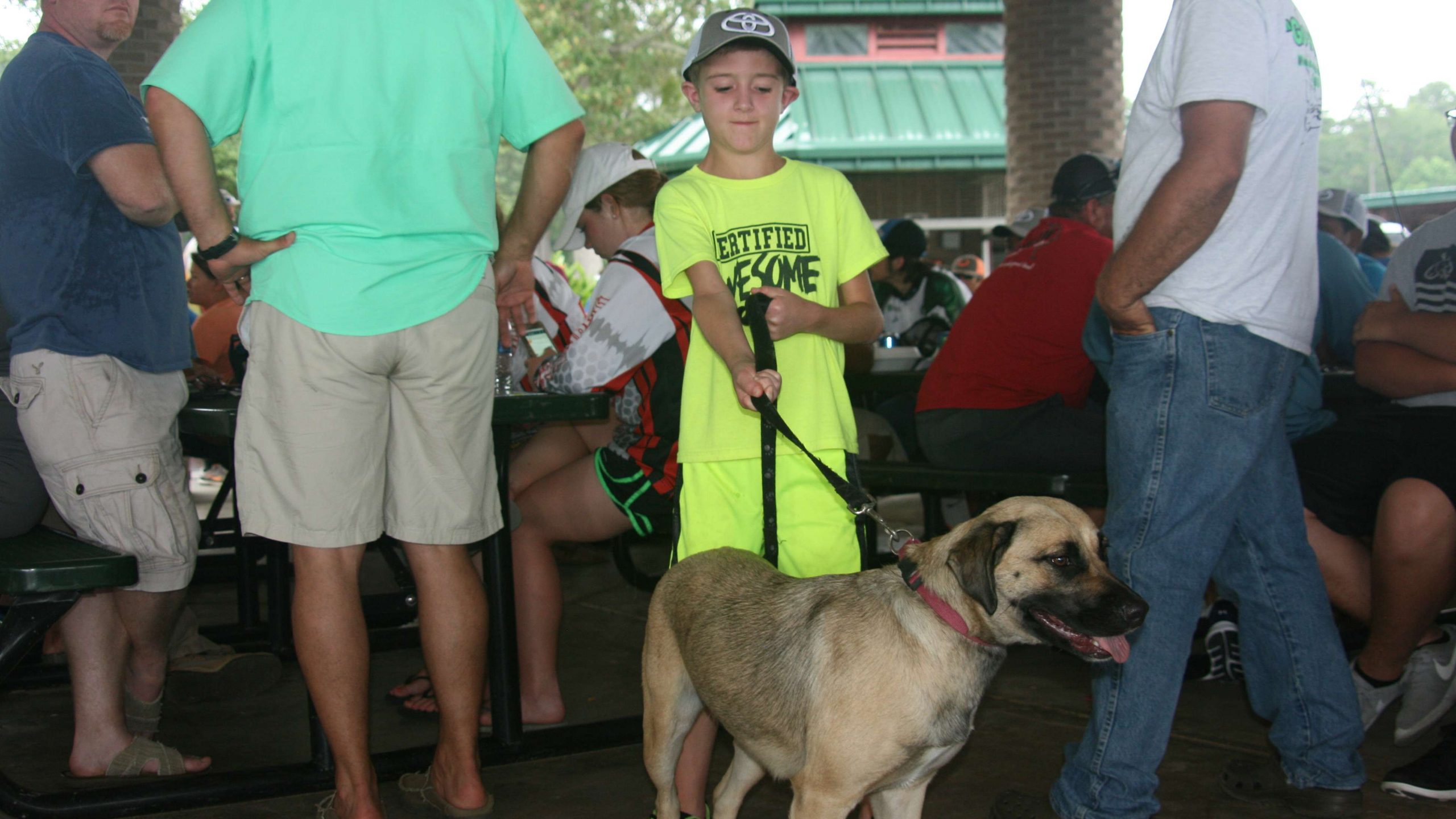 Hunter Dison, 8, had his dog Gator with him at registration and the anglers' meeting.