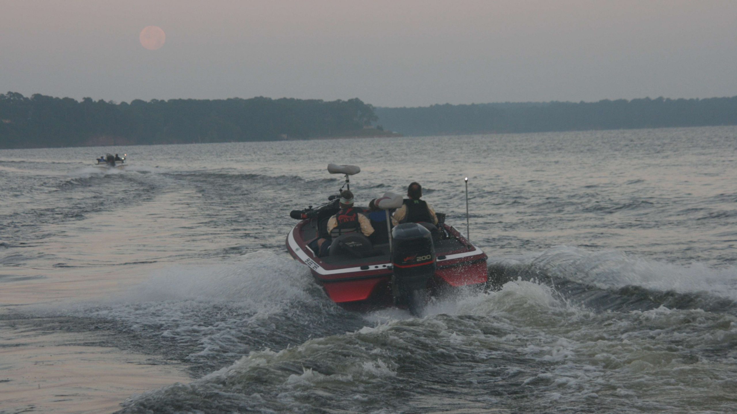 As soon as they are a safe distance from the dock, the boats fire up the outboards and shoot off across the water.