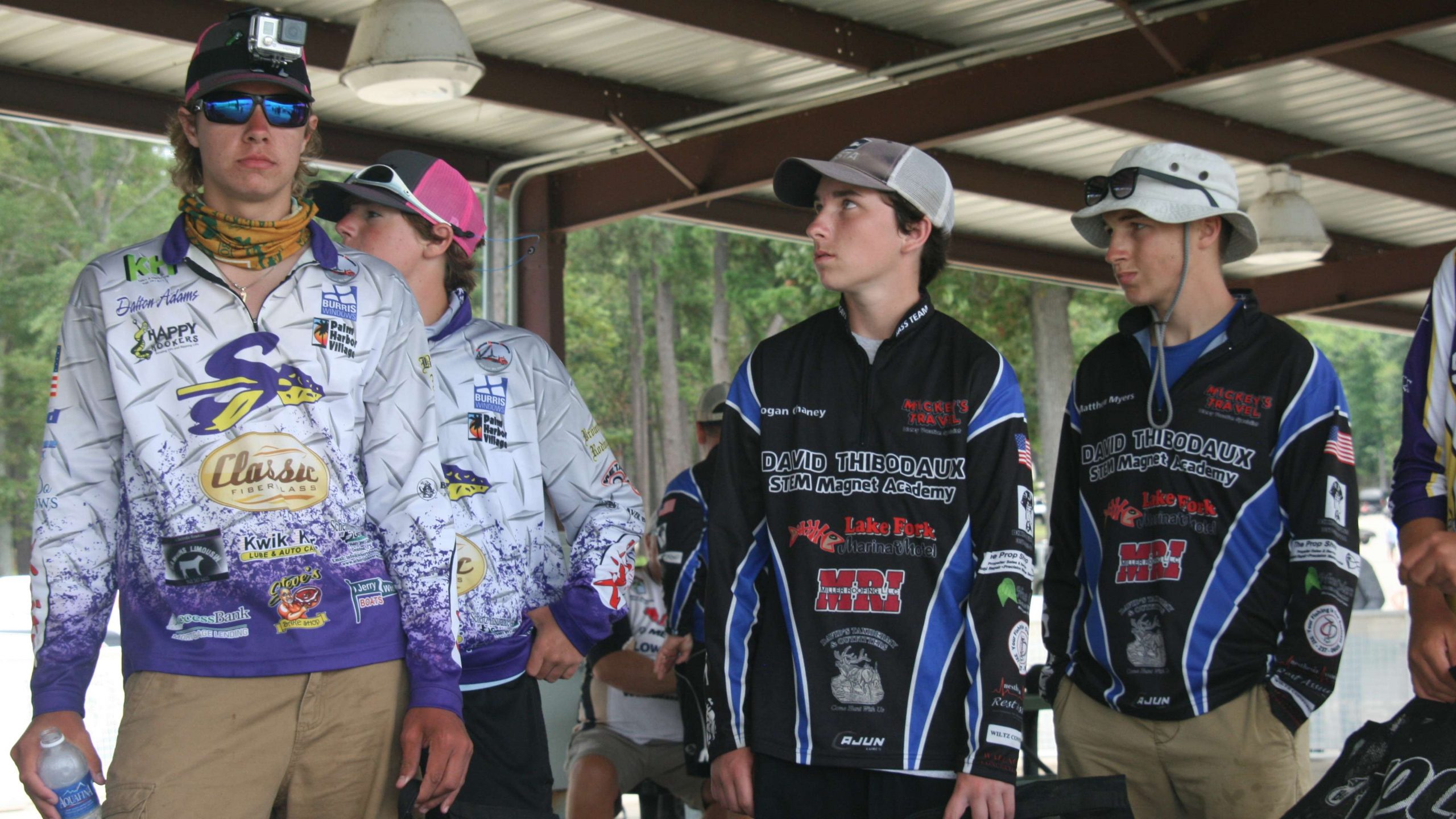 Hawkins and Adams of Sanger (Tex.) wait backstage to have their fish checked. They are joined by Logan Chaney and Matthew Myers of the David Thibodeaux (La.) Bass Team at the tanks.
