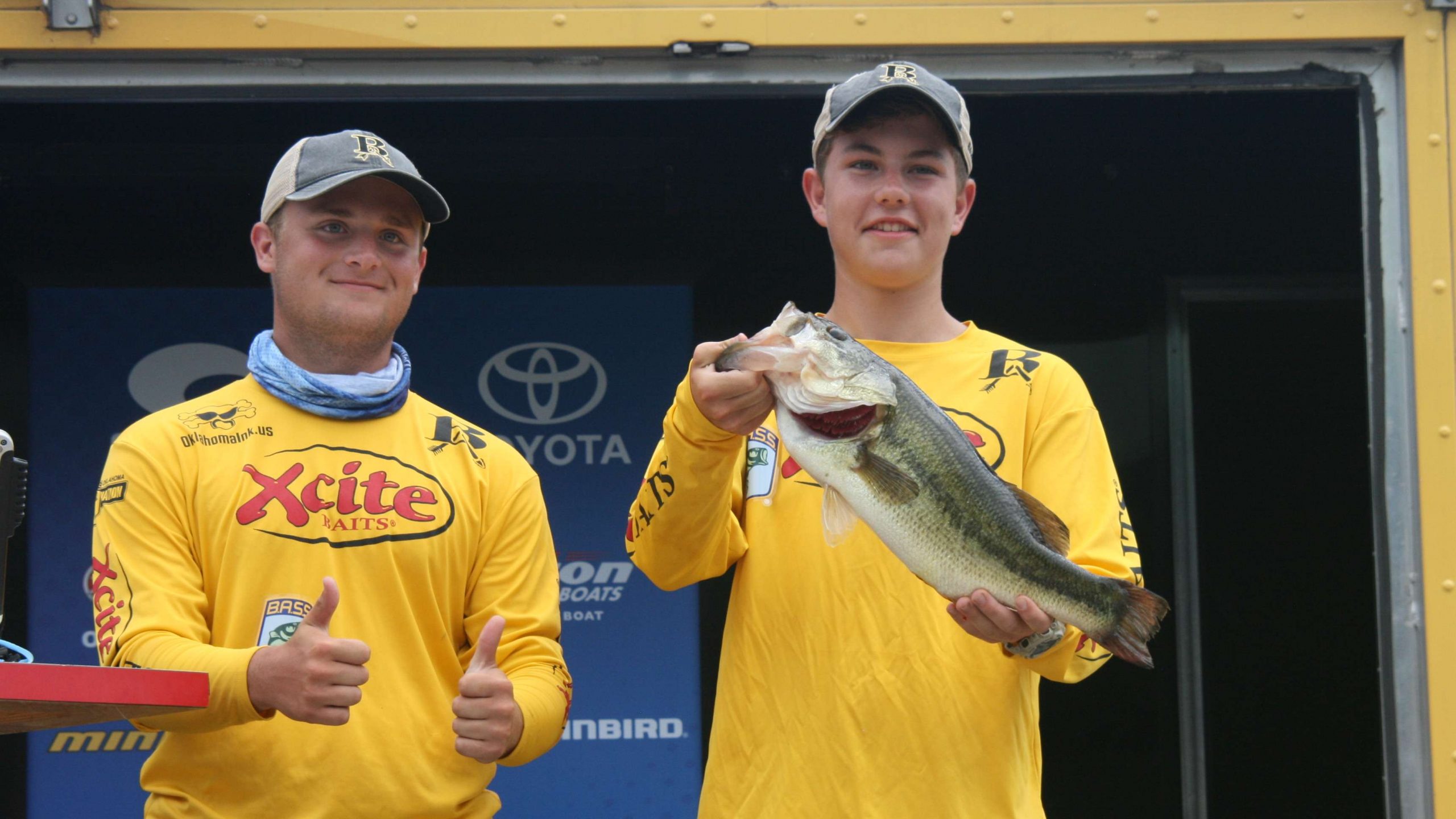 Eric Noyes, left, gives the thumbs up in approval of teammate Mason Mitchell's hefty bass. The team from Broken Arrow, Okla. finished 28th overall, and that was the only fish they caught.