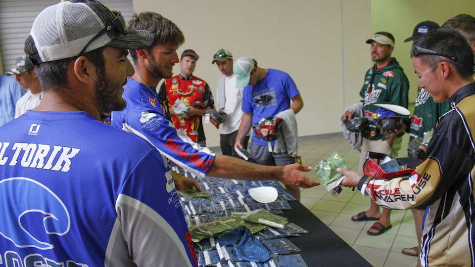 Thomas and James Oltorik, who are also college anglers, work the Costa booth.