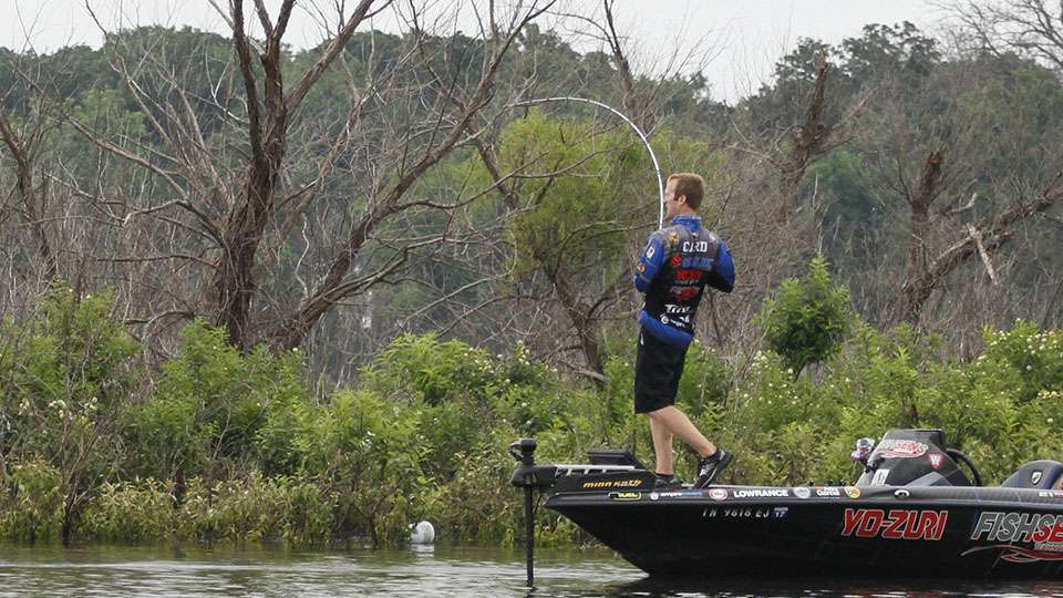 A giant bass blows up on his topwater and Card hooks up.