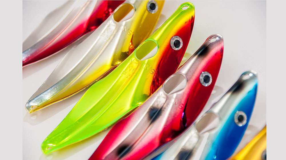 Fin-Wing</p>

<p>New lure? Not Really. The Fin-Wingâs unique design has been around since 1948; created in Michiganâs Upper Peninsula. Itâs the metal-spoon-meets-swimbait âlure that swimsâ design that sets this bait apart from all others.</p> 

<p>Cast and let it sink to a desired depth. A steady retrieve will allow it to retain its path. Pause it over an opening in the weeds and it turns snoot down and sways into the pocket. Speed up the recovery and it turns belly up and walks the perfect dog. Single hook included for adding a soft plastic for an even more weed-proof retrieve, as well bulked up presentation. 
