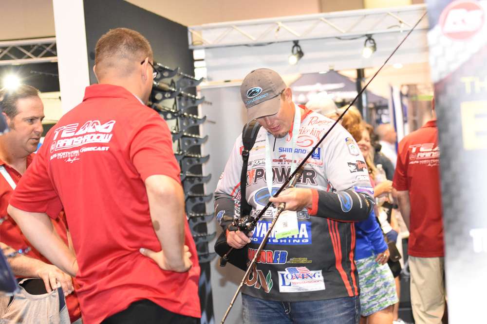 Keith Combs compares a pair of rods.